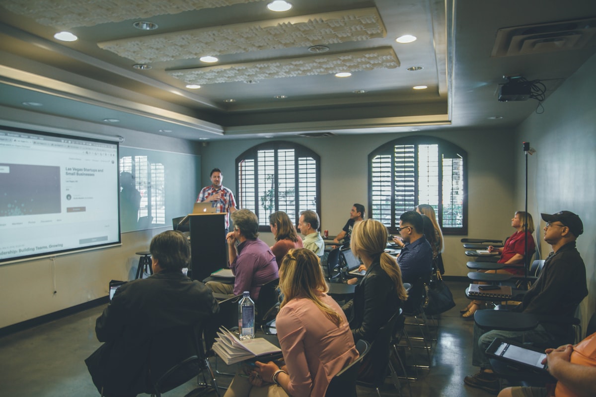 Speaker and audience in a seminar room